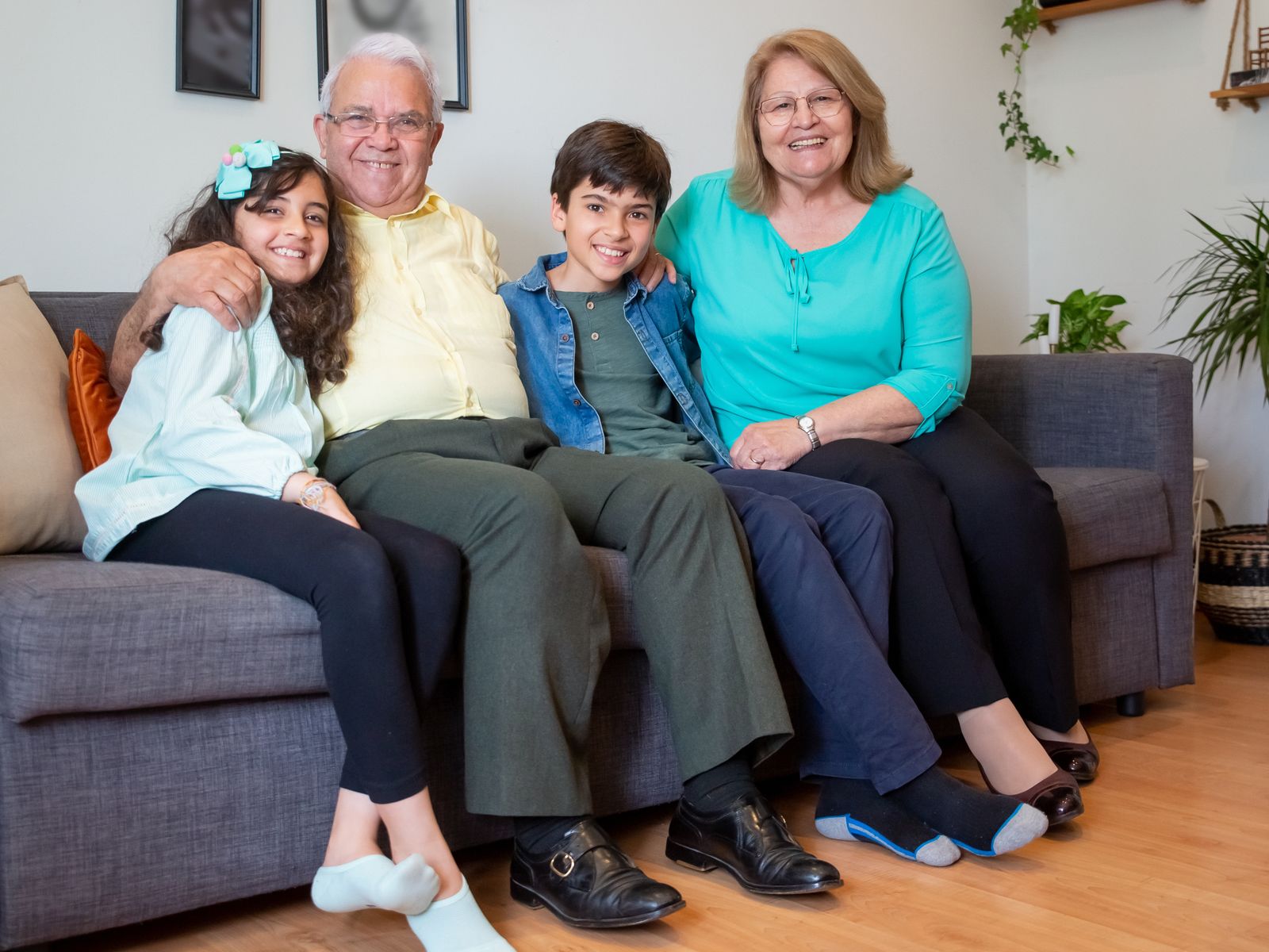 Grandparents spending a relaxed afternoon with their grandchildren at home